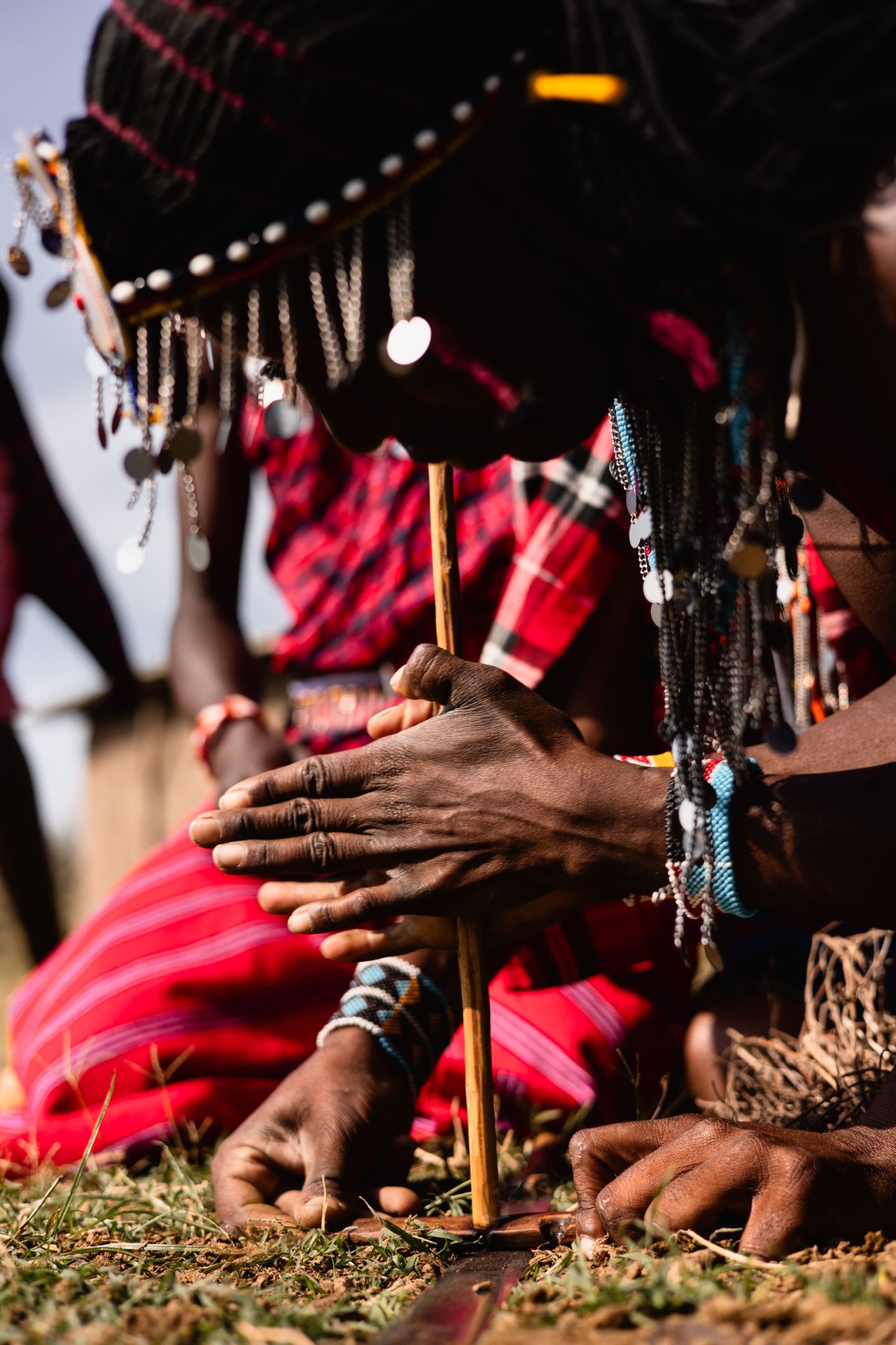 Close view of hands and layered Maasai beadwork
