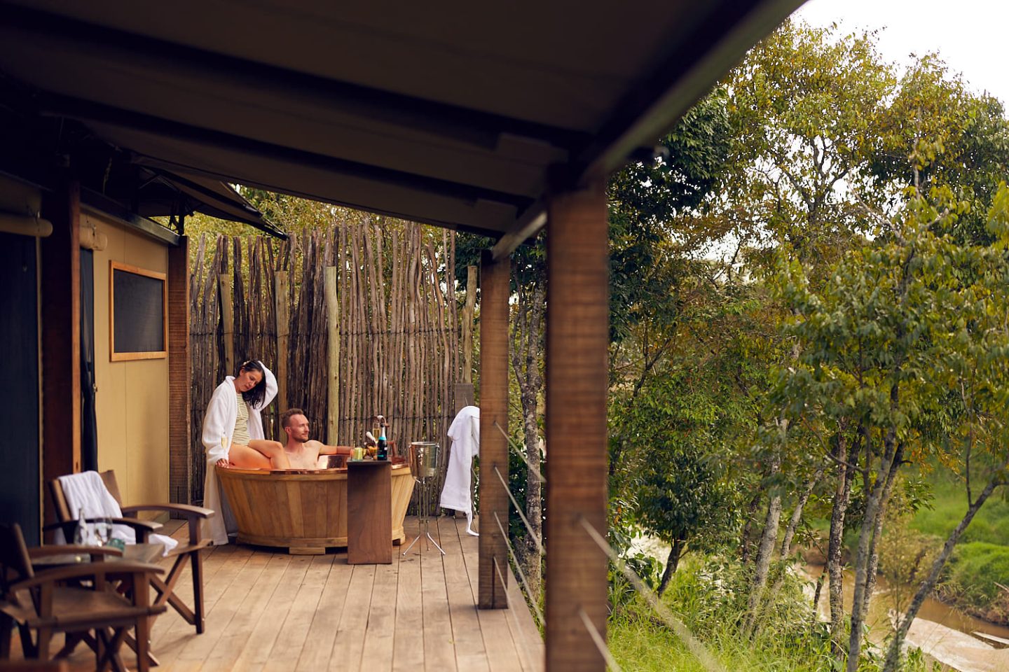 Guests in a room opening onto a private outdoor bath